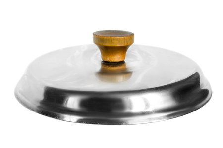Steel dishes lid with wooden knob isolated on white backgroundの写真素材