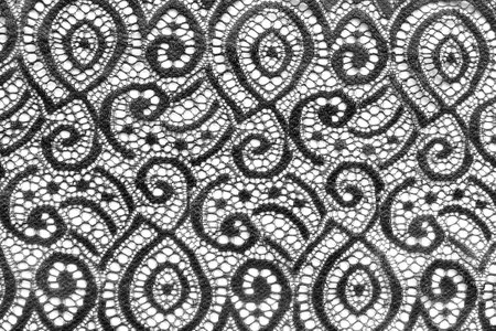 Black fabric abstract lace on white as a backgroundの写真素材