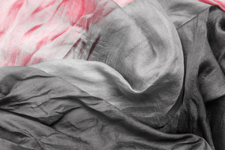 Abstract black and pink draped chiffon fabric as a backgroundの写真素材