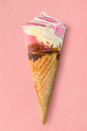 Waffle cone ice cream on pink studio backgroundの写真素材