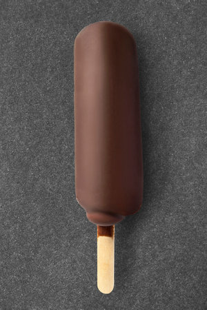 Chocolate glazed ice cream  on black studio backgroundの写真素材