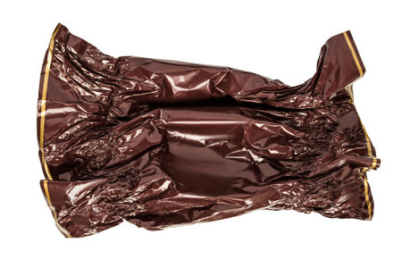 Blank empty crumpled brown candy wrapper isolated on white backgroundの写真素材