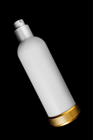 White frosted glass perfume spray bottle isolated on black backgroundの写真素材