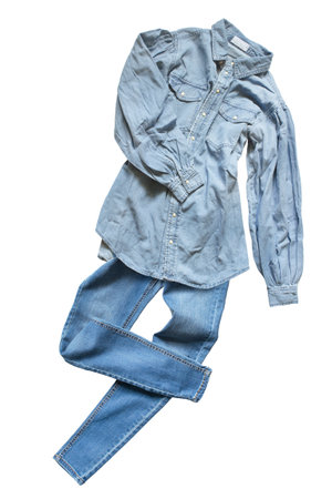 Blue denim folded jeans and oversized shirt suit isolated on white backgroundの写真素材