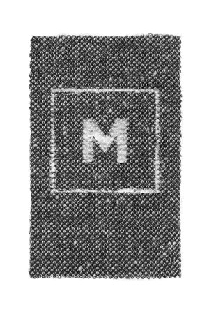 Size M fabric clothes label patch isolated on white backgroundの写真素材