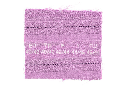 Pink fabric size printed clothes label patch isolated on white background