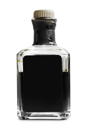 Half full vinegar bottle isolated on white background