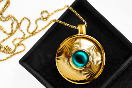 Vintage large golden pendant with topaz gem in black jewel boxの写真素材