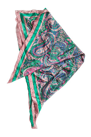 Vintage folded silk paisley kerchief isolated on white background