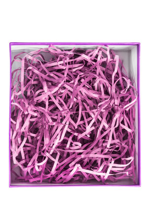Gift box with shredded filler purple paper isolated on white backgroundの写真素材