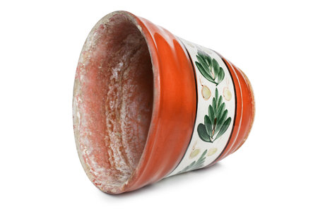 Empty dirty clay enamelled flowerpot lying on white backgroundの写真素材