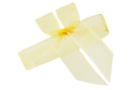 Golden ribbon tied bow isolated on white backgroundの写真素材