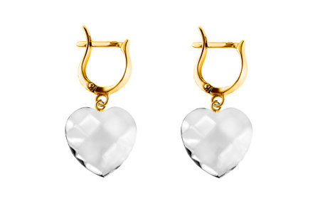 Crystal hearts elegant golden earrings isolated on white backgroundの写真素材