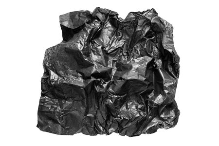 Piece of crumpled black packaging paper isolated over white