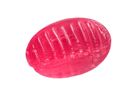 One pink lollipop candy isolated on white backgroundの写真素材