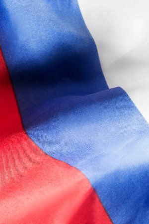 Draped Russian tricolor national flag closeup as a backgroundの写真素材