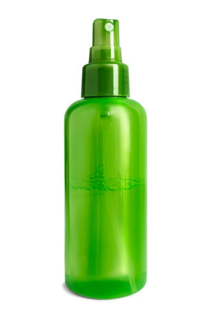 Green plastic facial mist spray bottle isolated on white backgroundの写真素材