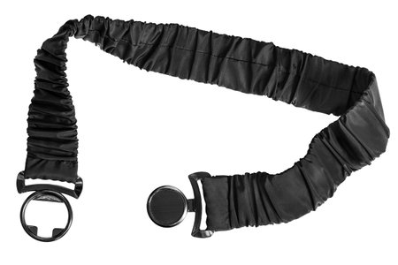 Black flexible fabric belt with metallic clasp buckle isolated over whiteの写真素材