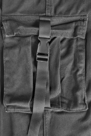 Black cotton fabric cargo flap patch pocket with fastex clasp closeupの写真素材