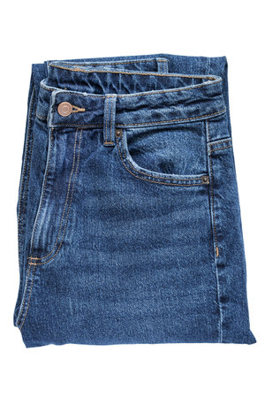 Dark blue folded jeans isolated on white backgroundの写真素材