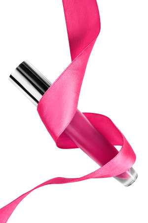 Pink lip gloss pack wrapped with pink satin ribbon isolated over whiteの写真素材