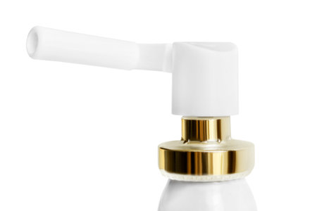 Medical throat spray nozzle closeup isolated over whiteの写真素材
