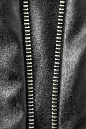 Black leather unzipped closeup as a backgroundの写真素材