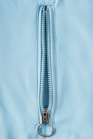 Unzipped pocket light blue fabric closeup as a backgroundの写真素材