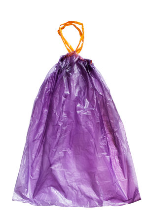 Large purple plastic tied trash bag isolated on white backgroundの写真素材
