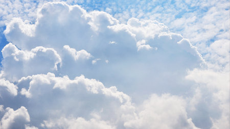 Large white cumulus fluffy cloud in the sky closeupの写真素材