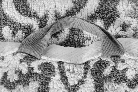 Black and white terry towel hanging loop closeup