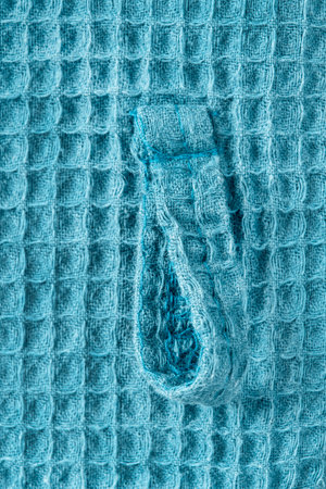 Waffle blue fabric clothes belt loop closeup as a backgroundの写真素材