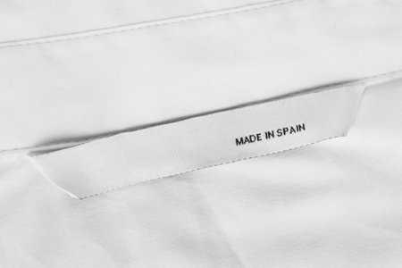 Clothes label text made in Spain on white blank fabric backgroundの写真素材