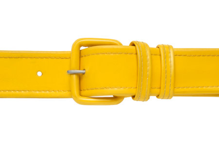 Yellow leatherette belt clasp isolated on white backgroundの写真素材