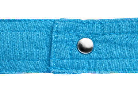 Blue cotton fabric strap with a snap button isolated over white closeup