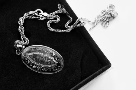 Vintage silver locket pendant in black jewel boxの写真素材