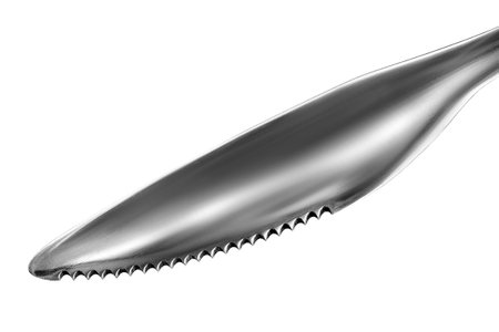 Serrated table knife closeup isolated over whiteの写真素材