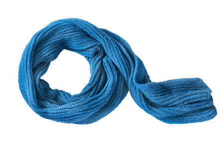 Blue knit wool cozy scarf tied isolated over whiteの写真素材