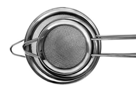Set of different size kitchen steel sieves isolated on white background