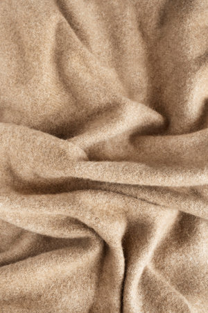 Draped camel color cashmere fabric as a backgroundの写真素材
