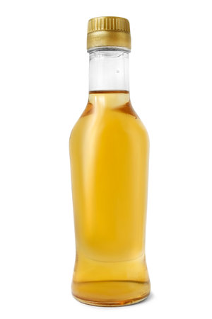 Full bottle of apple vinegar isolated on white backgroundの写真素材