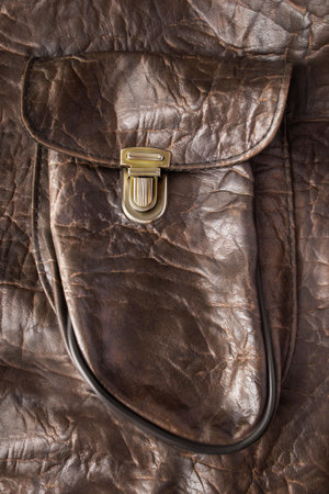 Brown artificial leather brown bag flap pocket closeupの写真素材