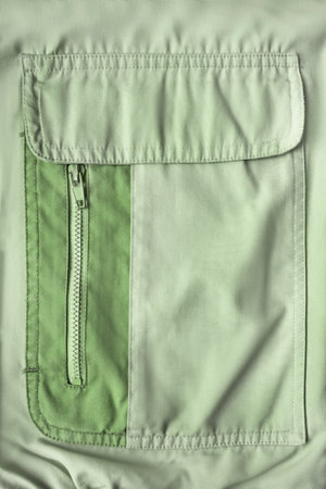 Green fabric jacket patch flap pocket with zipper closeupの写真素材