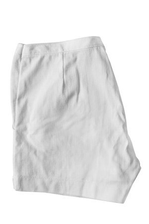 Folded white cotton shorts isolated on white backgroundの写真素材