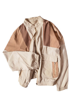 Beige oversize cotton bomber jacket isolated on white backgroundの写真素材