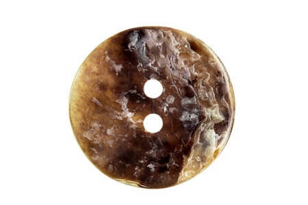 Brown clothes button isolated on white background