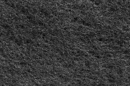 Black sponge fiber texture closeup as a backgroundの写真素材