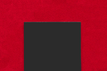 Blank black sign over red velvet background closeupの写真素材