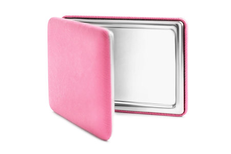Folding pocket mirror in pink leatherette cover isolated on white backgroundの写真素材