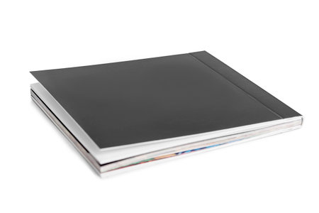 Black blank cover magazine lying on white backgroundの写真素材